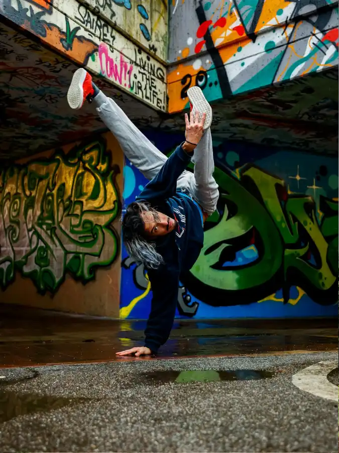 man-breakdancing-near-wall